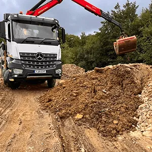 lorry picking up gravel