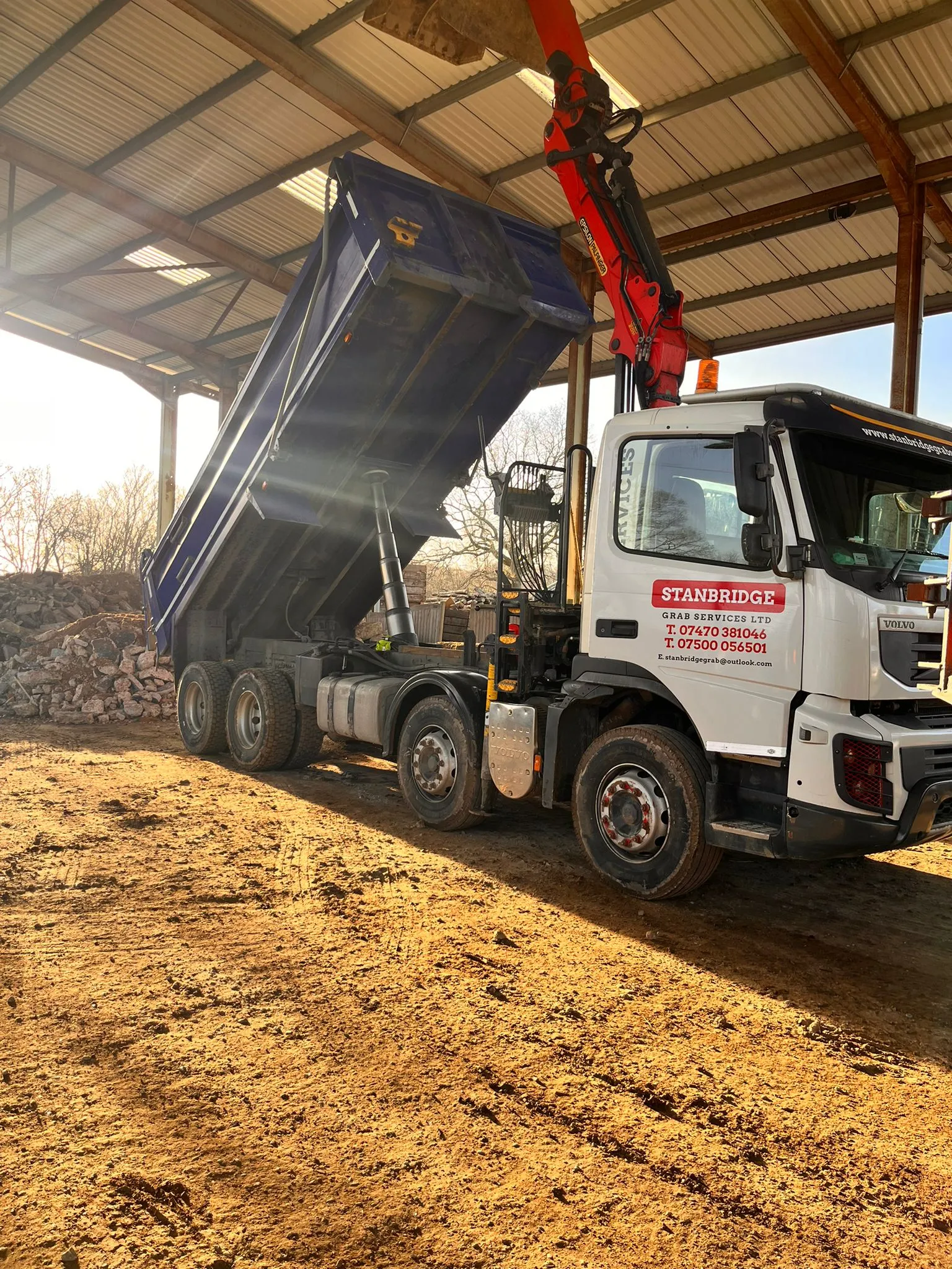 lorry picking up materials